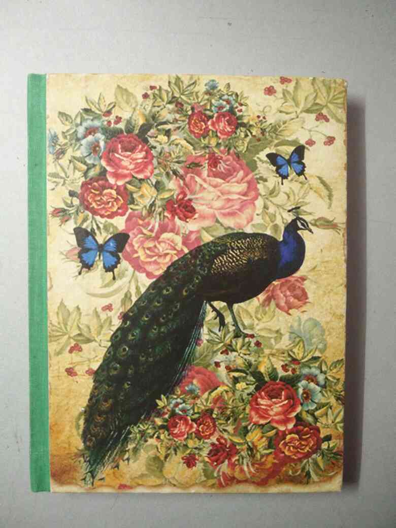 Handmade paper notebook..!! peacock design.. hard bound cover
size - 6