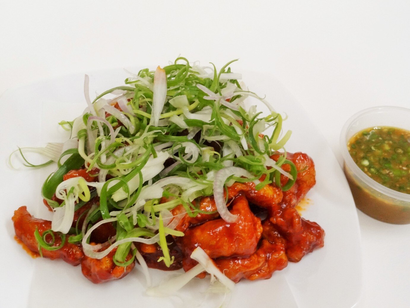 Seasoned a various hers and basic spiced meat kept for 24 hours in cool area after then fry twice at different temperature for improving of quality, and added sum of sliced Spring Onion with very hot spice sauce for forgetting stress and weather affection.