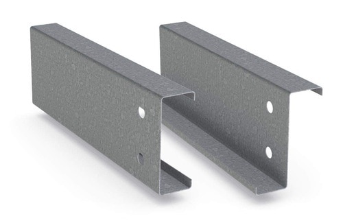 In steel construction, the term purlin typically refers to roof framing members that span parallel to the building eave, and support the roof decking or sheeting. The purlins are in turn supported by rafters or walls. Purlins are most commonly used in Metal Building Systems, where Z-shapes are utilized in a manner that allows flexural continuity between spans.
It is the practice in the steel industry that structural shapes are assigned representative designations for convenient shorthand description on drawings and documentation: Channel sections, with or without flange stiffeners, are usually referenced as C shapes; Channel sections without flange stiffeners are also referenced as U shapes; Point symmetric sections that are shaped similar to the letter Z are referenced as Z shapes. Section designations can be regional and even specific to a manufacturer. In steel building construction, secondary members such as purlins (roof) and girts (wall) are frequently cold-formed steel C, Z or U sections, (or mill rolled) C sections.
Cold formed members can be efficient on a weight basis relative to mill rolled sections for secondary member applications. Additionally, Z sections can be nested for transportation bundling and, on the building, lapped at the supports to develop a structurally efficient continuous beam across multiple supports.