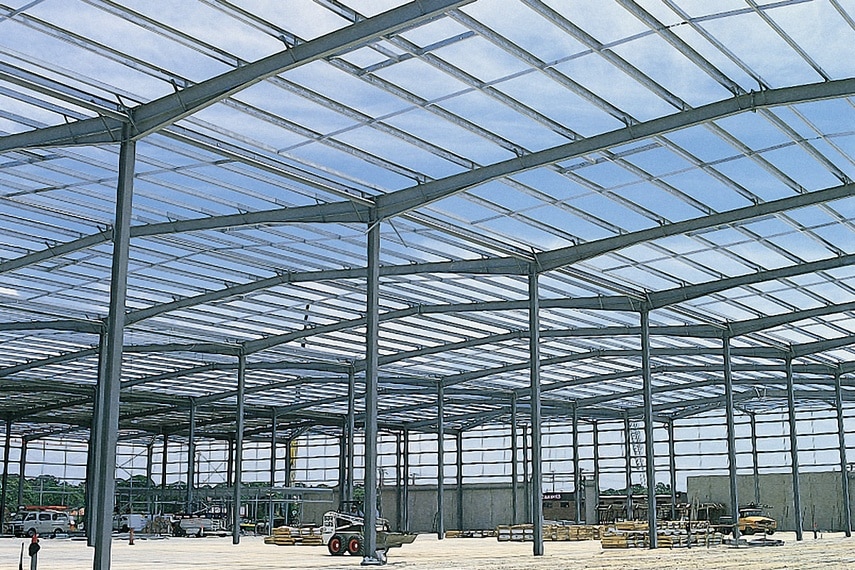 In steel construction, the term purlin typically refers to roof framing members that span parallel to the building eave, and support the roof decking or sheeting. The purlins are in turn supported by rafters or walls. Purlins are most commonly used in Metal Building Systems, where Z-shapes are utilized in a manner that allows flexural continuity between spans.
It is the practice in the steel industry that structural shapes are assigned representative designations for convenient shorthand description on drawings and documentation: Channel sections, with or without flange stiffeners, are usually referenced as C shapes; Channel sections without flange stiffeners are also referenced as U shapes; Point symmetric sections that are shaped similar to the letter Z are referenced as Z shapes. Section designations can be regional and even specific to a manufacturer. In steel building construction, secondary members such as purlins (roof) and girts (wall) are frequently cold-formed steel C, Z or U sections, (or mill rolled) C sections.
Cold formed members can be efficient on a weight basis relative to mill rolled sections for secondary member applications. Additionally, Z sections can be nested for transportation bundling and, on the building, lapped at the supports to develop a structurally efficient continuous beam across multiple supports.