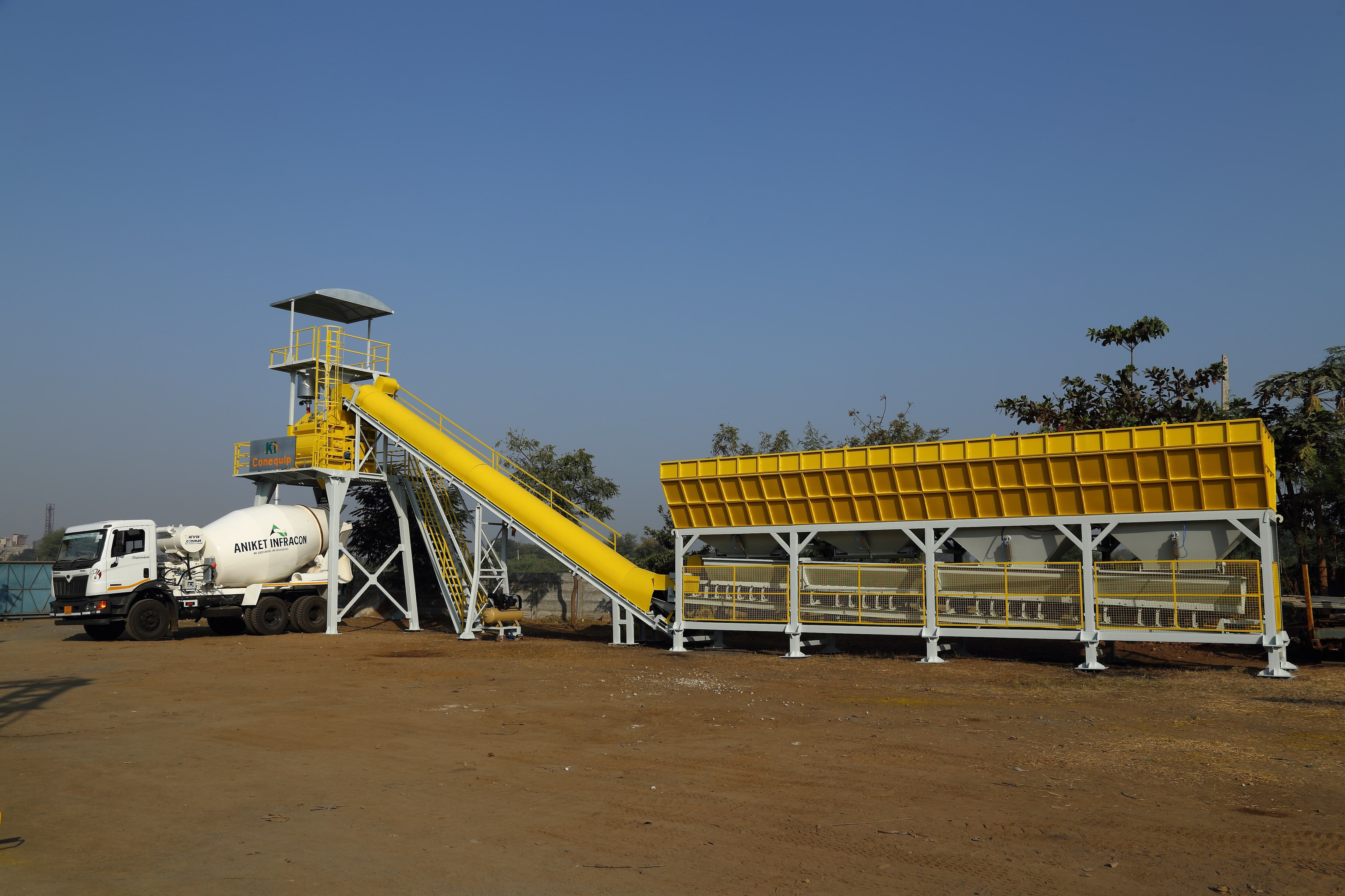 We are leading manufacturer, exporter and supplier of wide range of concrete batching plants.
You have ever seen a big machinery plants on construction sites. Do you really know the name of that plant and why it is used for? That’s called as a concrete batching plant. It’s a machine which mixes the various construction elements like sand, aggregates, water, additives and cement. These ingredients are weighed individually first & then mixed in this machine. These materials are widely used for various kinds of construction plants.
The mixing of each component is by weight but still, it’s possible to change & alter the measurement of distinct materials to keep ready different grade or a quality of concrete. Most of the grades of the concrete for our country India are as 1:2:4, 1:3:6, 1:1:2 etc. This ratio is in terms of cement, fine & coarse aggregates. It means that the mixed material has 1 part of cement, 3 parts of fines & 6 parts of aggregates. Weight is the only proportion here.
Concrete Plants Types:
Dry Mix Type:
As a name itself suggests that dry mix plants produce the recipes which are dry before dispatching them onto the transit mixer. All the needed materials such as sand, cement and aggregates are weighed & then inserted into the transit mixer. Water is then added into a transit mixer. The concrete is completely mixed in a mixer.
Wet Mix Type:
In wet mix machine, the ingredients are measured individually & then inserted into the mixing unit then the materials are mixed homogeneously and then are dispatched the same into the transit mixer or into a pumping unit. It is known as central mix plants and they provide more consistent mixture as all ingredients are combined under the computer assisted environment that makes sure the homogeneity of a product.
Now it’s time to talk about the styles of a concrete batching plant. One is stationary and second one is mobile. Stationary type is used when contractors want to produce a mixture from one place only. They don’t have to change place more often. The size is bigger and takes more time to establish than the mobile type. Today, the mobile style batch plants are reliable, accurate and production too and are designed to execute for years to come.
This is what you should know about the basics of Concrete Batching Plant before buying and start working with this.