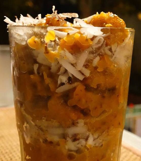 Blended dates in coconut milk served with a mix of resins, almonds, and steamed carrots.