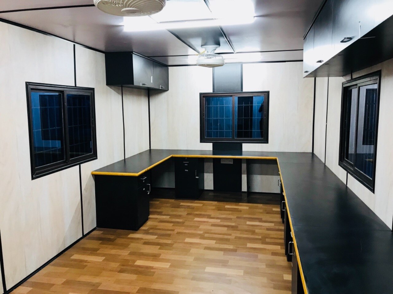 TECHNICAL SPECIFICATION
SI NO COMPONENT DESCRIPTION
01 Bottom Frame 100mmx50mm G, C Channel & pipe ISI Marked.
02 Top Frame 50mmx50mm Ms Square Pipe ISI Marked.
03 Stiffener Bottom 75mmx40mm C channel Angles & pipes ISI Marked.
04 Stiffener Top 40mmx20mm MS square pipe ISI Marked.
05 Side Post 50mmx50mm Ms square pipe ISI Marked.
06 Side Wall Stiffeners Specially formed CR sheets of make TATA / Jindal.
07 Paneling Outside Specially formed CR sheets TATA / Jindal.
08 Internal Wall Paneling 8mm OSL MDF of make Leo Classic.
09 Roof Outside Jindal CR sheet of 1.2mm thick properly sloped & water tight.
10 False Ceiling 8mm OSL MDF- Plane White of make Leo Classic.
11 Flooring 18mm Bison Panel with Vinyl carpet.
12 Aluminium Windows Sliding Aluminium Powder Coated Windows With 4mm Glass.
13 Door Ms door with holder draft & handles.
14 Insulation 50mm glass wool insulation on wall & 25mm on ceiling.
15 Wiring All wiring of concealed type & PVC insulated copper wire.
16 Electrical Fittings All electrical fittings in portable cabin shall be 220-240V.AC 50Hz.
Tubes, Bulkhead, Fan, switches, Sockets & Telephone.
Air conditioner point (MCB) (All type of window
Air conditioning Systems as desired upon can be
Installed polycab wire.
17 Earthing Earthing point will be provided for safety.
18 Outside Painting 1 coat of Epoxy primer with 2 coats of Epoxy Paint.
19 Hooks Specially formed hooks for easy lifting and shifting.