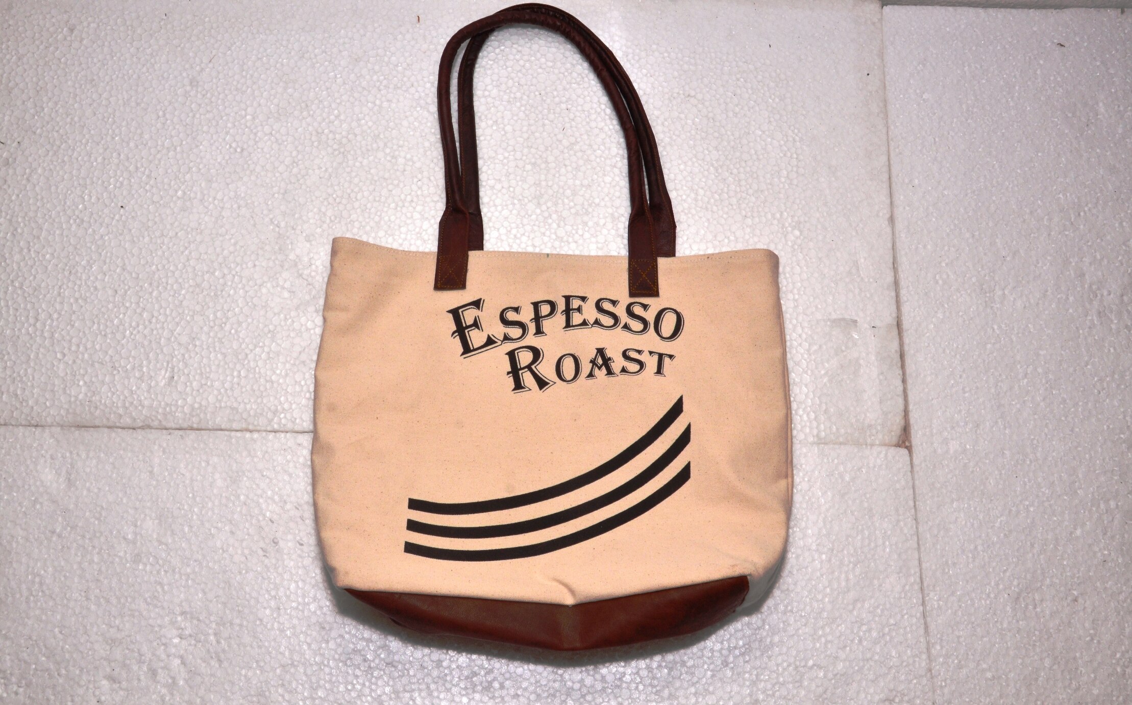 Functional and Stylish: tote includes contrast stitching, quality metal hardware, and slender shoulder straps. Fits 15.6