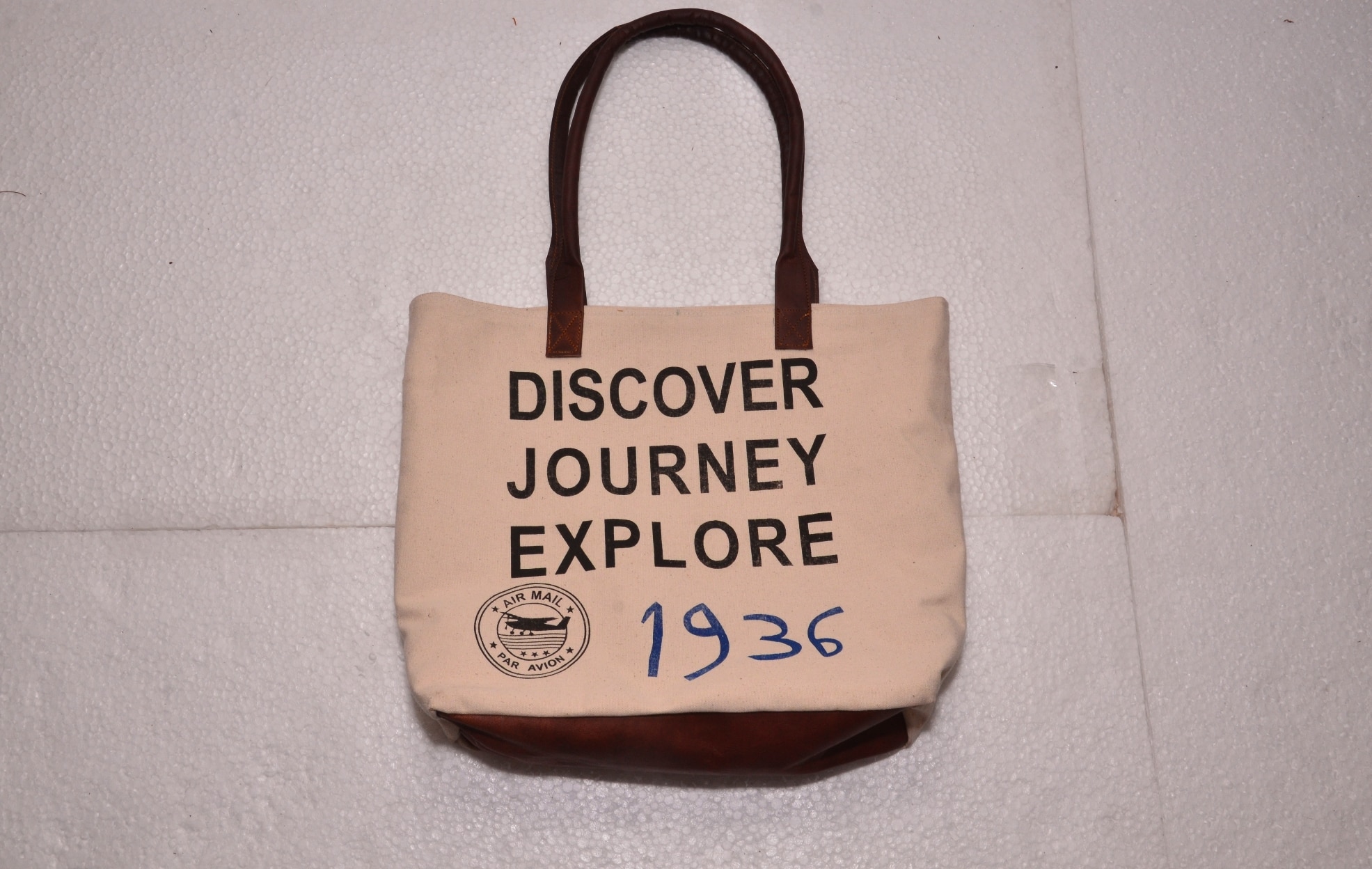 Functional and Stylish: tote includes contrast stitching, quality metal hardware, and slender shoulder straps. Fits 15.6