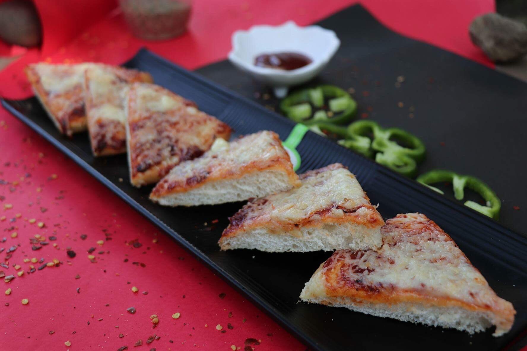 We have a large variety of pizzas,Classic Veg Pizza,Tomato & Cheese Pizza,Onion Capcicum pizza And many more.