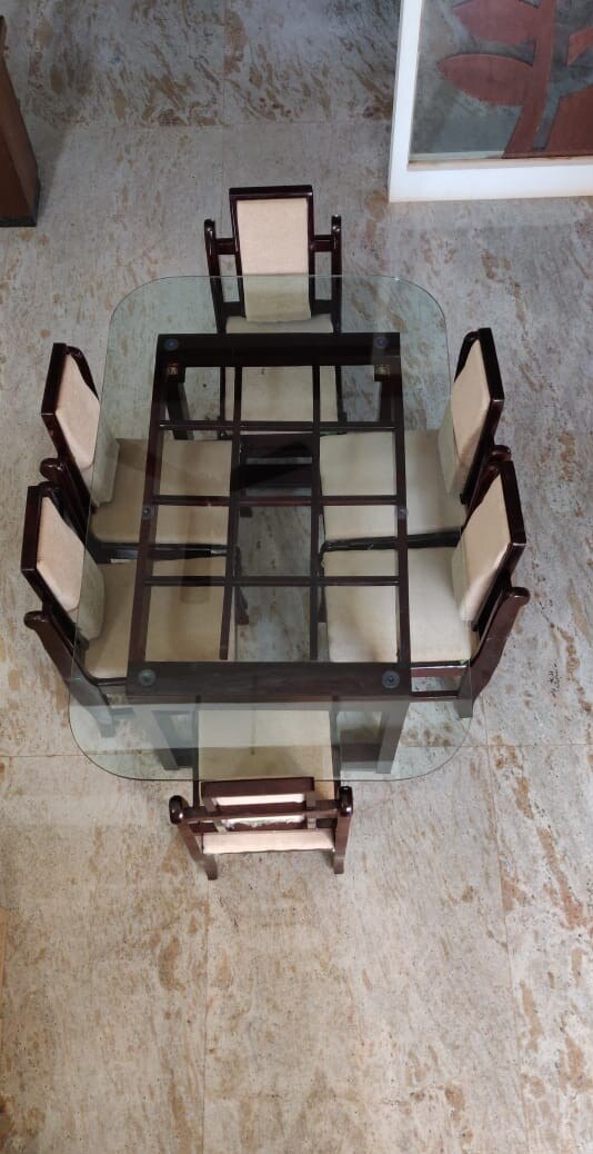 Made from season Rosewood with glass top.
