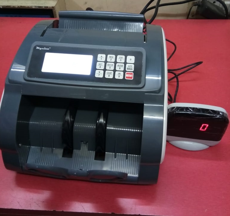 MYCICA 805 LOOSE NOTE COUNTING MACHINE
Can Detect and Count New ₹50, ₹200, ₹500 & ₹ 2000 notes , Automatic UV(ultraviolet) Counterfeit detection, Automatic MG (magnetic) counterfeit detection. With batching and adding and self-examination functions.
One LCD display and one LED External display. Display changes to red on detection. Detects Pre 2005 notes. Upgradable software