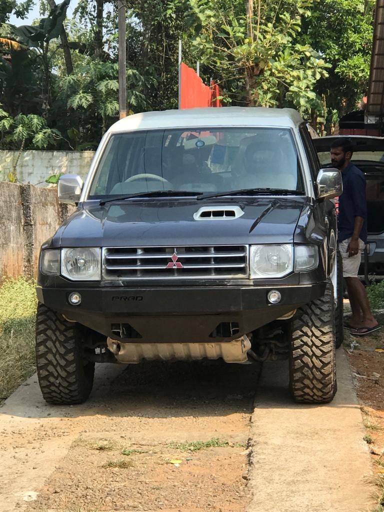Mitsubishi Pajero Bumper is made of 3mm CR. The bumper is mounted on to the chassis of the vehicle (bolt-on). The bumper is designed keeping the approach and departure angles in mind for good off-road capability and giving your vehicle a muscular look. The bumper comes along with a pair of hella inset foglamps, indicators and a detachable bullbar.