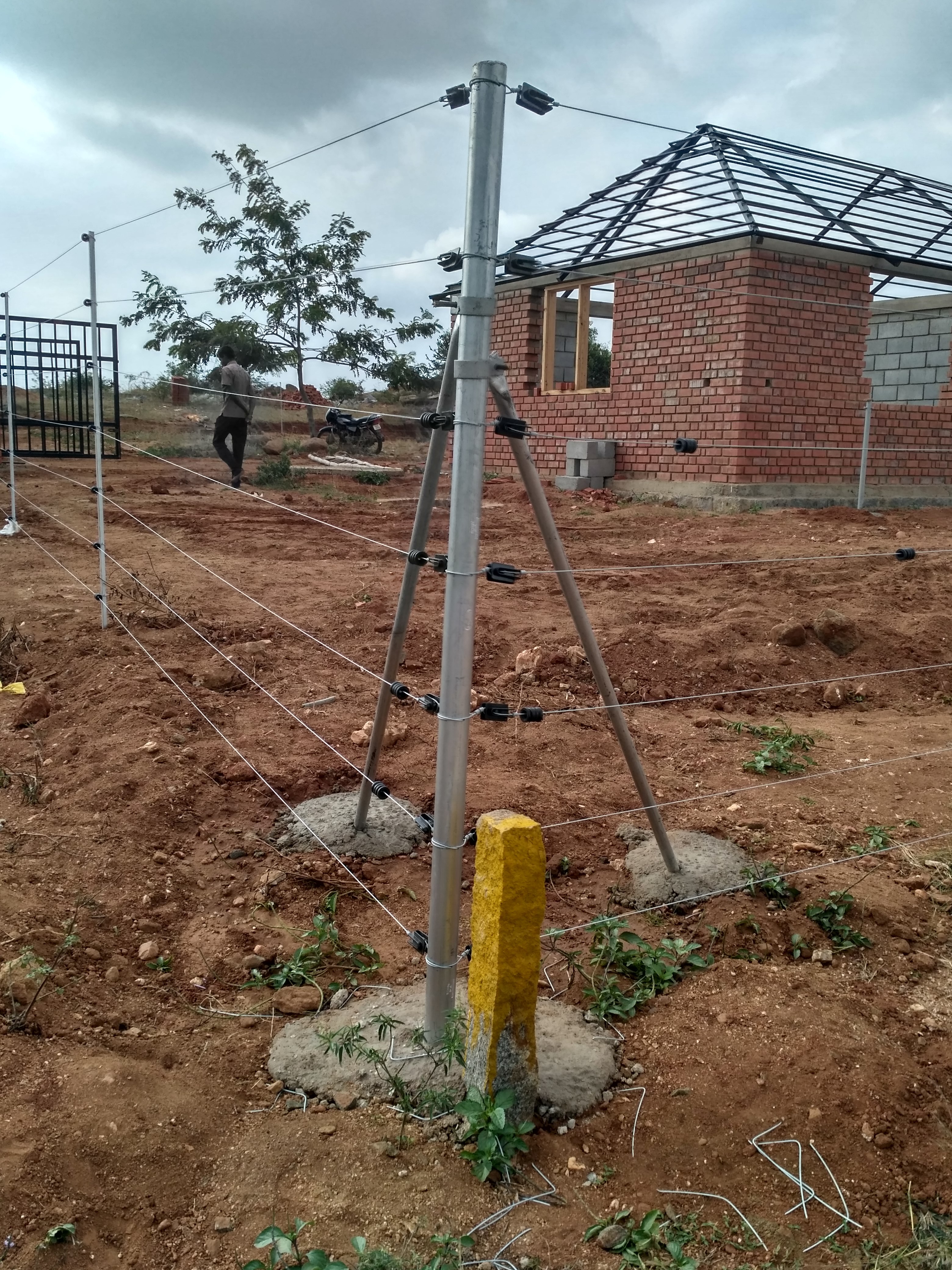 • Enriched by our vast industrial experience in this business, we are involved in offering an enormous quality range of Solar Fencing System (Solar Fencing for Farm House / Forest/ Agriculture/ Security). Features: High grade material Easy to install Robust design Agricultural Solar Fencing We are one of the leading Suppliers of Agriculture Solar Fencing System. This is one of the best method for protecting crops and property from domestic and wild animal. It supplies a low amount of electric current to those entering the fenced area. This fence system enables the control of animals by giving them a short, sharp but safe shock, which is sufficiently memorable that they never forget it. Residential Solar Fencing: Provide complete security for residential houses. This is one of the best method of protecting the property . Industrial Solar Fencing Industrial Solar fencing System is the most complete form of security to factories and Industries. Forest Solar Fencing Forest Solar Fencing System is designed to protect villages, communities, resorts located in or near forest areas and stop wild animals from straying into agriculture fields and farmlands bordering forests