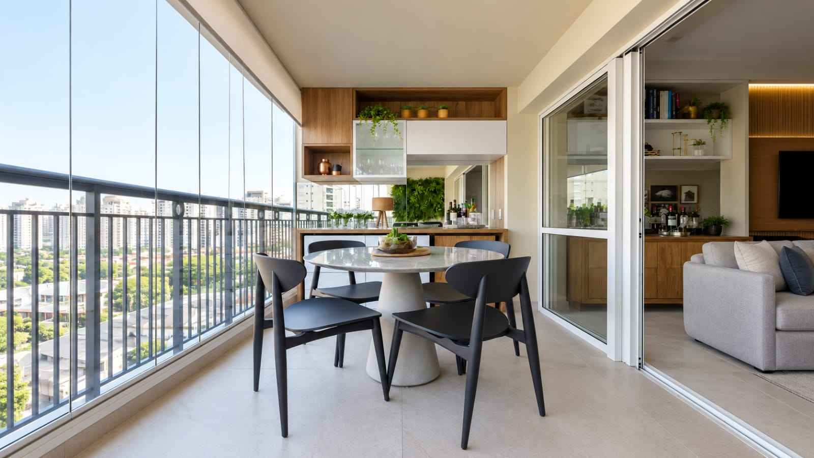 Contemporary Glass Balcony Dining Area with Warm Wooden Storage | Kanchipuram image 1