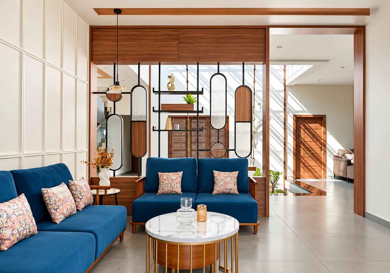 Geometric Wooden Slat Partition with Decorative Shelves and Blue Sofa | Ambattur image 1
