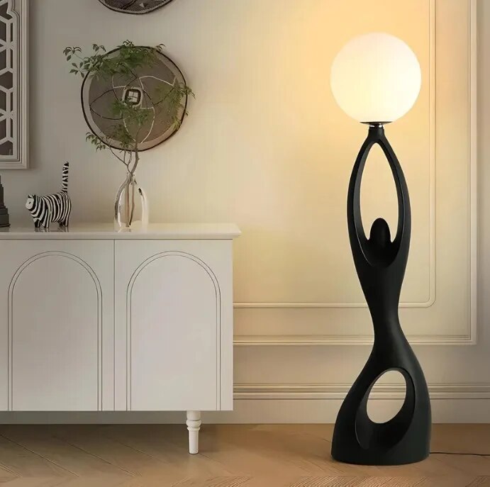 Designer Black sculpture holding ball Floor Lamp image 1