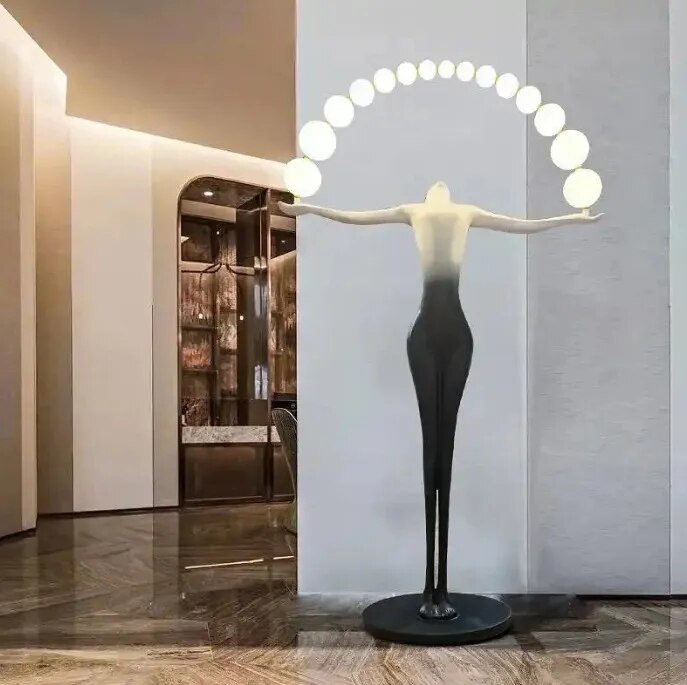 Designer Black White sculpture holding ball floor lamp image 1