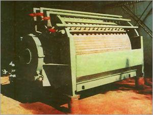 Application Suction Drum Filter are used for washing and concentrating fibrous products in the paper and pulp industry.Main applications are multi-stage brown-stock washing plants, washing and thickening of fibrous material with low freeness,  and use as sheet formation filters for wet machines for difficult products.Principle of Operation: The Stock suspension flows with a consistency of 0.8-1% which is most favourable for the filtration process, free from turbulence, via the filter inlet box into the filter tough. the vacuum required for the filtration process is produced by a vacuum pump or a barometric tube. The circumference of the filter drum is divided into cells of equal size, connected with the control disk by a tubular system inside the drum. This control disk carries the control head dividing the zones by means of infinity plugs:1. Sheet formation zone2. washing and suction drying zone.3. Discharge and ventilation zone