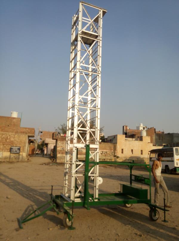 AQPC MODEL No: 5051 SPECIAL “ AQPC” ALUMINIUM Tiltable Tower Extendable Telescopic, Square Type Ladder made out of SPECIAL Extruded, Tested Quality Hindalco make ALUMINIUM Section of size • 66mm x 31mm x 3mm thick approx. With steps made of aluminium fluited pipes of 25mm (1”) dia approx. • At a distance of 300mm (12”) • Best rope pulleys and winch arrangement with suitable size steel rope for extending & closing the extended section of ladder to any required height fabricated • Best m.s.channel frames duly covered with 16 swg m.s.sheet for carrying materials and four m.s. forged solid rubber casted special wheels with double ball bearings of suitable dia complete with tow bar. • The platform of size 2’x2’ on the top guarded from three sides will be provided for safe working.• Further the ladder may be provided with mechanical system to tilt the complete ladder on rest and again lift the same for working having addl.• Winch set complete with required m.s.pulleys and steel wire rope to enable to reduce extra manpower to handle the ladder.• In addition to make the ladder more sturdy & safe 4 nos.• Adjustable jacks at four ends of the m.s.frame and m.s.channel base covered with m.s.sheet and m.s.sheet fabricated tool box of suitable size may be provided.AVAILABLE IN ALL SIZE FROM 10ft TO 60ft
