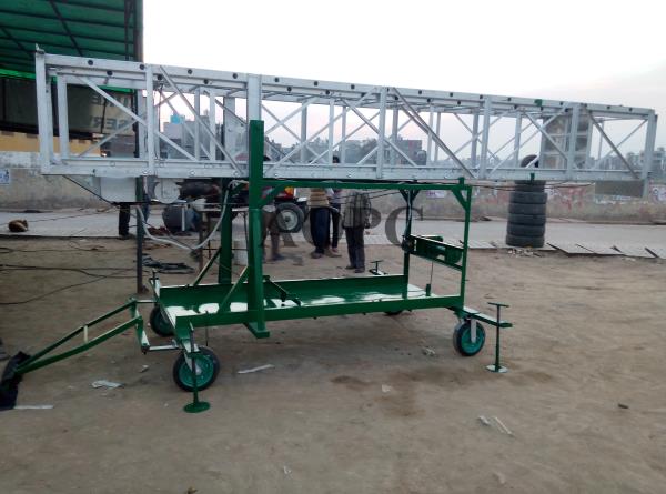 AQPC MODEL No: 1005 SPECIAL AQPC ALUMINIUM Tiltable Square typeFully Extendable, motorized tower ladder Motorize tower ladder available in two folds made out of aluminum C section of size 66 68mm x 31 75mm x 3 20mmThick approx with aluminium Fluited pipe 25.4mm 1 inch dia approxAt the required distance of 300mm apart complete with set of 8mm Usa martain dubleSteel wire rope, M.S. pulleys and winch system for extended and closing the ladder atAny required height fabricated on M.S. channel frame of size 100mm x 50mm mountedOn four special type castor wheels (two revolving and two fixed) of size 12” x 3”1/2With ball bearings.Workmen’s platform is provided 3 ft. Below from the top size 24” x 24” and one toolTray of size 24” x 8” on the top. The platform is guarded from three sides for safeWorking. A handle is also provided on the front side of ladder for easy moving.Further the ladder may be provided motorized with mechanical system to tilt theComplete ladder on rest and again lift the same for working having additional winch setCompleted with Required M.S pulley and steel wire rope to enable to reduce extra manpower to handle The ladder. And gear boxes 1 No. Of 01ton & 01 ton each brakes areprovided on the 2no. Fixed wheels and 4no. Adjustable Jacks at four ends of theM.S.Frame and M.S.Channel Base covered with M.S.Sheet andTrolly Base size :– 08 x 5ft Tiltable ladder Height 8ft., Closed 10 Feet X Extended 17 FeetClosed 12 Feet X Extended 21 FeetClosed 14 Feet X Extended 25 FeetClosed 16 Feet X Extended 28 FeetClosed 18 Feet X Extended 32 FeetClosed 20 Feet X Extended 35 FeetClosed 24 Feet X Extended 40 FeetClosed . 20 Feet X Extended 50 Feet