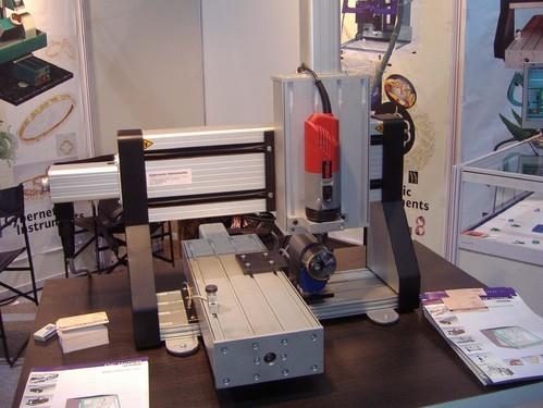 Cybernetic offers our smallest desktop CNC machine Model 2525. Model 2525 has work envelope of 250 mm X 250 mm with Z axis travel of 80 mm. This small desktop machine can be used for verious applications like engraving, light metal mill/ drilling , rapid prorotyping. Model 2525 has precision ball screws and linear guides on all 3 axis that are driven by micro-stepping and smooth stepper motors. The machine is connected to PC via USB cable and our driver software. The software is capable of reading variety of file formats like ISO G & M codes, HPGL, DXF and many more. Technical Details:Working Area: X=250mm, Y= 250mm, Z=80mmDrive Elements : Precision ball screws and stepper motorsAccuracy : 0.01mm, Resolution : 0.01mmSpindle Power : 800 watt, 8000-30000 RPMTool Size : up to 8 mm diameterControl System : USB controlJoy stick : optionalSupported file formats: ISO G & M codes, DXf, HPGL3D milling capacity : Available
