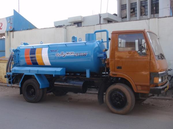 MANIAR ‘GullyMan’ is an advanced technology with a blow-back system for cleaning cesspit, cesspool and manhole chambers. This Machine is capable of creating a very high degree of air pressure which breaks the silt sedimentation that gets accumulated at the bottom of the cesspit, cesspool and manhole chambers. It is equipped with major IMPORTED components including its unique heavy duty Vacuum Pump. It is capable of sucking particles up to 40 to 50mm dia along with sludge from a distance of 100 feet and depth up to 25 feet. The tank can be tilted (optional) at a specified angle and the hinged type rear door can be opened and closed hydraulically to drain out the collected liquid waste or silt. Utmost care has been taken to install adequate safety devices such as Auto shut-off valves, Imported Siphon filter, Safety pressure release valve, Quick release coupling are few safety features among those safety instruments, which ensure that the equipment operates with safety & avoid chances of occurrences of an accident.Vehicle: TATA, Eicher, Ashok Leyland.Sludge Tank Capacity:  5000Material: Mild Steel of 5 mm thicknessSuction Pump: Imported Italian makeCapacity: 390 m3/hPower for Vacuum Pump: Is taken from Side PTO / Split shaft PTO.Suction Hose dia: 3