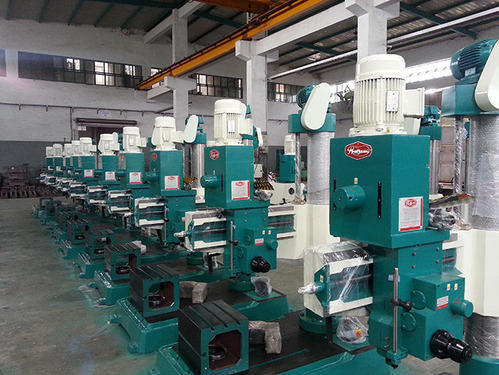 We are a leading Manufacturer of auto feed radial drilling machine, heavy duty geared radial drilling machine, geared radial drilling machine, double column radial drilling machine, geared drilling machine and fine feed radial drilling machine from Rajkot, India.Product Details:Minimum Order Quantity : 1 UnitTable Size : 800 X 240 mmDrilling Head Motor : 1.5 HP / 960 RPMMax. Drilling Capacity : 40mmLifting Motor : 1 HP/1440 RPMLifting Motor V belt : B-23 / B-24Model no : R40AADrilling in MS : 40 mmSpindle Travel : 250 mmSpindle Speed : 70-1225 X 9 (RPM x Step)Tapping in MS : 25 mmSpindle Hole taper : MT-4Drilling in CI : 45 mmRough Boring in MS : 75 mmSpindle Autofeed Ranges : 0.05 & 0.09 (mm/rev.)Max Min Distance Spindle Nose to Base : 950 / 250 mmMax Min Distance Spindle Center to Column : 930 / 400 mmMaximum Drilling Radius : 1020 mmMachine Measurement : 1510 X 850 X 2100 mmDiameter of Column : 180 mmWork Table Dimension : 300 X 300 X 385 mmCoolant Tank Inbuilt In Base : 440 X 430 X 140 mm 26 LitresBrand : PrakashAutomatic Grade : AutomaticOil bath Gear BoxThe all new design of gear box in model PMW R40AA,R40G and P40AA is having 9 speed with all 9 gears made up of hardened NiCr steel up to HRC 50 55. Oil bath gear box and hardened gears give very long life to the machine. Rotation and easy sliding of gears in bearings gives very high reliability. Gear are internally six splined and shaft are externally splinedAll the gears in gearbox are machined on imported WMW Germany make gear shaper.All the splines in the gear box are machined on imported PFAUTER Germany make spline milling machine.Autofeed Gear Box Autofeed gear box used in Machine R40AA, R40BA & P40AA is having gears made up of NiCr Steel with heavy 2.5 module. All gears are also hardened. Two worm gears are made up of heavy duty 2.82 module teeth. All the shafts in the Gear Box are supported through good quality bearings and not the Bushes. Engaging Of Autofeed through Taper Cone MechanismAs in the lathe machines enables maximum loading capacity leaving behind other machinesFeatures:9 Spindle speeds with single speed motorHardened GearsHardened & Ground Spindle, RAM, PinionSingle Piece ArmTaper WedgeLonger Gun Metal Nut for Lifting of ArmExtra Accessories:Drill Chuck & ArborKeyless Dill Chuck & ArborWork TableExtra Long ColumnTapping Attachment (Mechanical)Drill ViceStandard Accessories:Electrical Panel Board & SwitchesElectrical MotorsCoolant pump with Spout Assembly in Model R40AA
