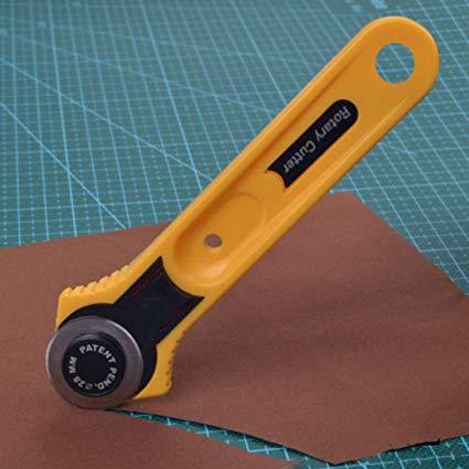 A rotary cutter is a tool generally used by quilters to cut fabric. It consists of a handle with a circular blade that rotates, thus the tool's name. ... Several layers of fabric can be cut simultaneously with a sharp (fresh) blade, making it easier to cut out patchwork pieces of the same shape and size than with scissors.PRICE:350/.-+ GST