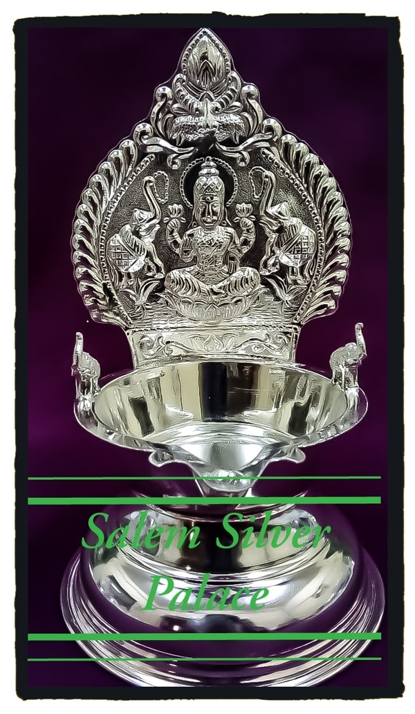 Silver kamakshi Villakku. Double side kamakshi Villakku with elephant sides. Weight range starts from 100 gms. For wholesale and retail orders contact us www.salemsilverpalace.in 9894353579Silver wholesaleSalemTaminadu