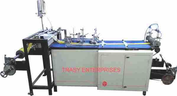 This machine was developed in India by TRASY in 1996 It was then displayed in PLASTINDIA exhibition. This is used for converting reverse printed PVC sheet into PVC label sleeve. It uses cold adhesive available locally.The latest development in this machine is to coat a hot melt on printed side of heat shrinkable PVC, to restrict label from rotation on the container. Features ::• EASY START STOP ACTION. • AUTO GLUE FILLING SYSTEM. • CONTROLLED TENSION WINDING. • CONTROLLED DISPENSING OF GLUE. GLUING SPEED : 60 to 80m/min. THICKNESS OF PVC: 12 to 150 micron.MAX. UNWIND SIZE: 600 mmMAX. REWIND DIA. : 450 mm