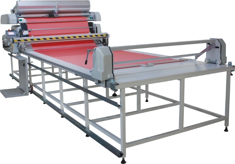 General Properties
CERTAIN SPREADS MODES SUPPORTED WEIGHTING UP 120 KGS (264LBS)
WITH TURNTABLE IT CAN BE USED FOR LIGHT FABRIC
Simplified graphical display that is easy to learn and easy to train new operators
Stores 50 different fabric set up files for quick retrieval to accelerate future spreading jobs
Available in Turkish, English and any other foreign languages if requested
MULTI FUNCTION THROTTLE
ENABLES THE OPERATOR TO CONTROL
Threading/Rewinding of fabric
Start/Stop of spreading with one hand
OPERATOR PLATFORM
Allows operator to ride alongside the table
CRADLE FEED SYSTEM PROVIDES
Tension-free spreading even difficult fabrics
Electric cradle tilts for easy fabric roll loading/unloading
Eliminates use of a fabric roll bar
ATTACHMENTS
Zigzag equipment
Rear catcher
Movable front catcher
Automatic cutting device
ML1 Master Lift
SPREADING MODES
Face up or face down
Face to face with or without end catchers
Face to face one way
Multi length spreading
SYSTEM FEATURES
Electronic edge control responsive to variable speed
Automatic stop with safety sensors in case of emergency
Automatic pre-centering of material beginning during threading
Variable speed control at forward/backward turns «Save Time»
No cloth stop function
Ply counter
Programmable lay length and end allowance settings
Four-whell drive with wheels
Turntable provides automatic rewinding, threading and positioning of material