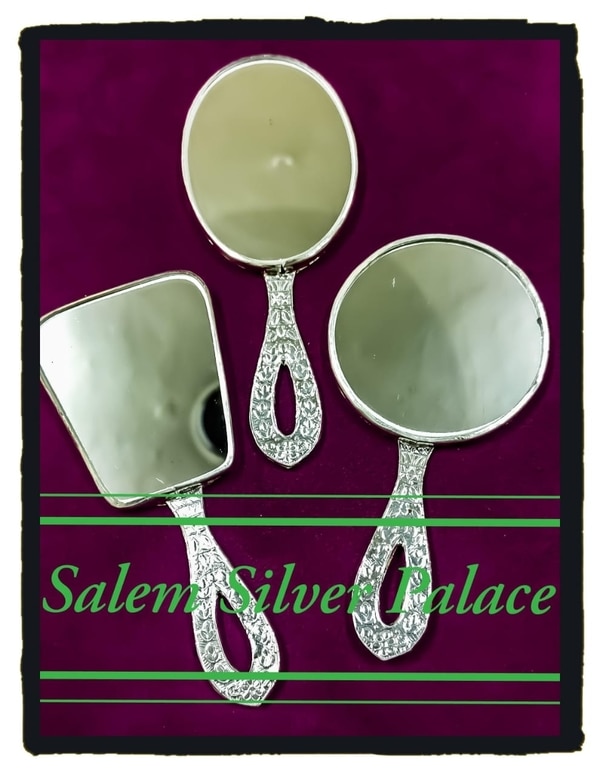 Silver hand mirror. Suitable for travel purposes. Little handy silver mirror fits your handy make-up kit. For details contactSalem Silver Palace9894353579Silver wholesaleSalemTamilnaduIndia 🇮🇳