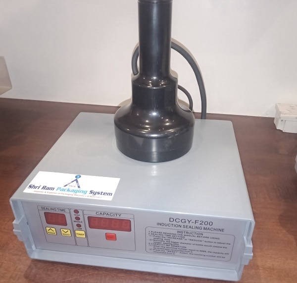 A electro-magnetic induction Sealing machine is mainly applicable operation of non- metal bottleneck(i.e plastic , glass )FeaturesDCGY F-200 which features of flat threaded cap , but not applicable to capping operation of metal &non threaded pressing cap , with dia 20-100 mm ad active handle ,high cap with over 3mm, spacing between cap surface & bottle neck after screwed in , especially , it is suitable for the customers who carrying out continuous capping operation for large output and lot.Technical SpecificationModel DCGY F-200 (20-100 mm)Voltage(V/Hz) 220/50Power(W) 500 wweight 5 kg