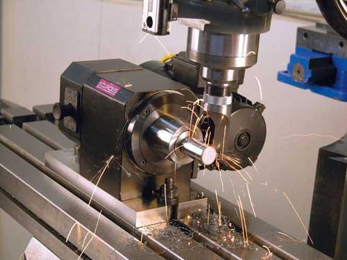 CNC Turning is a manufacturing process in which bars of material are held in a chuck and rotated while a tool is fed to the piece to remove material to create the desired shape. CNC lathes or turning centers have tooling mounted on a turret which is computer-controlled.