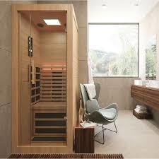 A Sauna is a bathhouse  or room , usually made of wood , which uses dry heat to induce perspiration  , with steam being produced by pouring water on heated stone . perspiration or sweating is the one of the main ways our bodies get rid of the traces of hundreds of toxins that accumulate  inside us from pesticides .