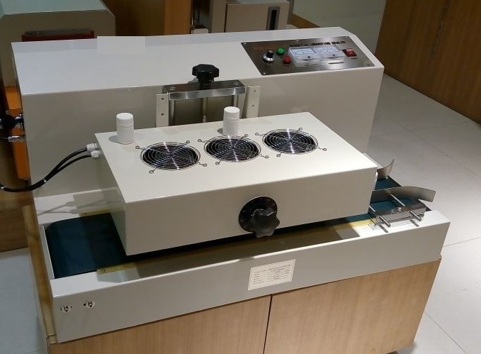 Hualian Continuous Induction Sealer Machine as table-style continuous magnetic induction sealing machine is major suitable for capping operation of flat-capped small bottleneck with thread. Especially, it is suitable for the customers who carrying out continuous capping operation for large output and lot. This continuous magnetic induction sealer machine is suitable in food industry ,pharmaceutical industry, chemical industry, agro industry. Continuous induction sealer utilizes electro magnetic induction principle to produce instant high heat to melt aluminum foil. Then it adheres to the bung hole, reaching the aim of wet-proof, leakage-proof, mildew-proof and extending preservation time. Now it is widely used as sealing package machine in industries such as pharmaceuticals, pesticides, pesticides, lubricant and cosmetics etc.