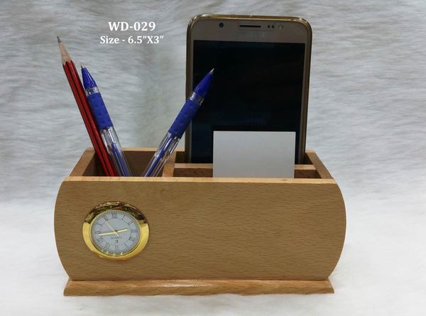 WOODEN PEN HOLDER WITH MOBILE AND CARD HOLDER AND CLOCKGST WILL BE EXTRA.ENGRAVING WILL DONE WITH EXTRA CHARGES.