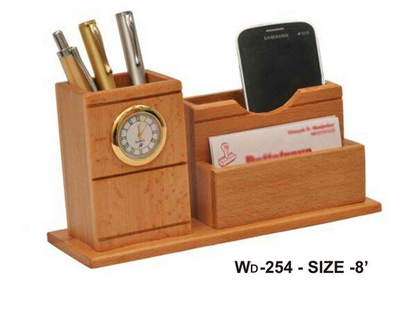 WOODEN PEN HOLDER WITH MOBILE AND CARD HOLDER AND CLOCKGST WILL BE EXTRA.ENGRAVING WILL DONE WITH EXTRA CHARGES.