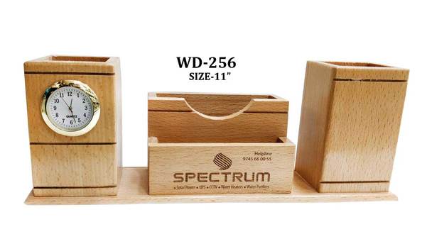 WOODEN PEN HOLDER WITH MOBILE AND CARD HOLDER AND CLOCKGST WILL BE EXTRA.ENGRAVING WILL DONE WITH EXTRA CHARGES.