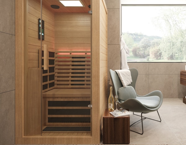 A Sauna is a wooden cabin designed to experience dry heat sessions to induce perspiration, cleansing pores, and flushing out toxins. In traditional saunas, steam is produced by pouring water on heated stones. Modern saunas often use infrared technology instead to heat special rocks and charcoal. Sweating out is one of the main ways our bodies to get rid of the traces of myriad toxins that accumulate inside us from pesticides, drugs and man-made chemicals. 15 minutes in a sauna can help you sweat as much as you might otherwise do over an entire day or more.  A sauna may bring health benefits such as:Increased Circulation – Step into a sauna and you will experience increased blood circulation. Better circulation can help in reducing muscle soreness, improving joint movement, and easing arthritis pain.Helps To De-Stress – As the heat in a sauna improves blood circulation in the body, it is a fantastic way to relax and reduce stress levels. This can improve feelings of well-being.Detoxification – Saunas flush out toxins from your body. It stimulates the body to release fat-soluble toxins, and other toxic chemicals via sweat pores more effectively than any other forms of heat therapy or exercise.Helps In Weight Loss –Cellulite, a gel-like substance made up of fat, water and wastes, which is trapped in pockets under the skin, is removed when perspiration is induced in a sauna’s environment. Thus, clearing the unwanted debris.Improving Cardiovascular Health – The sauna has a similar effect of having moderate cardio exercises in a gym, which is good for your cardiovascular health.