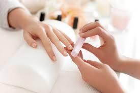 A manicure is a cosmetic beauty treatment for the fingernails and hands performed at home or in a nail salon. A manicure consists of filing and shaping the free edge of nails, pushing and clipping any nonliving tissue, treatments with various liquids, massage of the hand, and the application of fingernail polish.