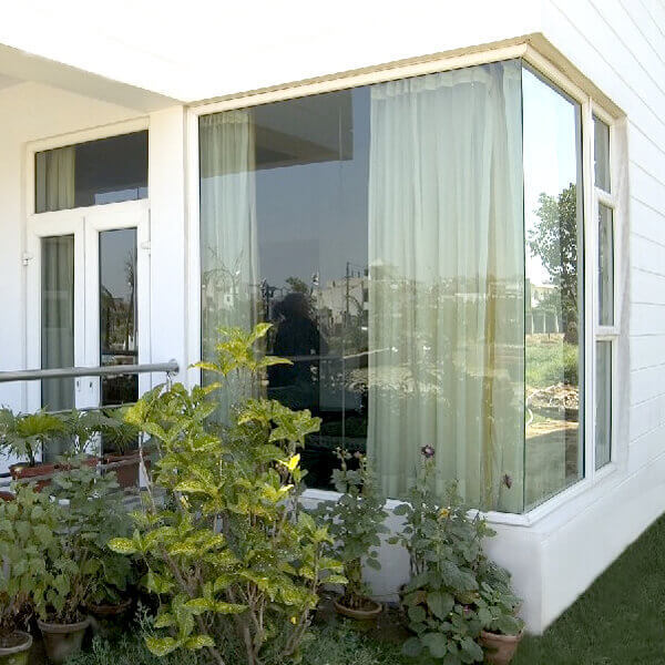 Glass to glass window is an arrangement of glass windows where they meet at a 90° angle at the corner of a room. These glass windows are joined without the use of any mullions. This arrangement helps in enhancing the amount of light entering your home, remarkably enhancing its overall aesthetic value.FEATURES & BENEFITSThe major benefits of having a glass to glass window installed in your home include: -Glass to glass corner windows provide a better viewHelps increase the aesthetic value of your houseIt allows more light to enter your house which is important for your healthThe glass is weather resistant and the window setup is not susceptible to rustYou get a lot of designs and colour options in glass to glass corner windows