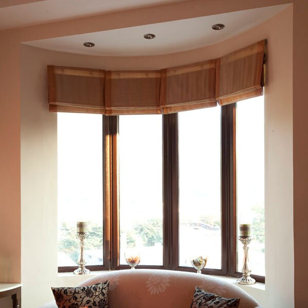 The bay window design refers to a combination of three or more windows that are projected outwards from the main wall, forming a bay in a room. A bay window adds a sense of elegance to any room. These windows can be crafted into a square, polygon, semi-hexagonal, or semi-octagonal bays. Known for their functionality and attractive designs, bay windows are said to be one of the most sophisticated window styles in interior design. Today, designers have come up with many types of bay windows, the beauty of which is par excellence.One type that has seen a lot of popularity recently would be uPVC bay windows which are made with un-plasticized polyvinyl chloride. These windows are the latest trend in the market, and Fenesta, being one of the largest manufacturers of uPVC bay windows, has a wide range of options in uPVC bay window styles for you to choose from. These windows have several benefits that offset the cost of uPVC bay windows.FEATURES & BENEFITSThe installation of a bay window at your home will add some extra space and dimension to your room, increasing the square footage of the area. Another benefit of the bay window design for homes is that they offer better ventilation. Since they are crafted into various angles, you can enjoy the breeze from various directions. These uPVC Bay Windows are UV resistant, weather-resistant, termite-resistant and require very little maintenance. These types of windows offer sound insulation, Long-lasting in nature, are corrosion resistant, and are not prone to fading.uPVC bay windows are energy-efficient and extremely safe and secure. A maximum of eight sides can be achieved in the combinations of casement, sliders, and fixed.UPVC BAY WINDOWS FOR KITCHEN & LIVING ROOMThe myriad styles in uPVC bay windows are enough to spruce up your home. If you are planning to get bay windows for your kitchen or living room, there are some design ideas that you can consider. As there are many different types of bay windows available, you can choose the style you want accordingly. Firstly, there is the ‘Box Bay Windows’ to consider, which are designed in the shape of boxes (squares) where the window consists of a set of three panes, and the bay so formed is further covered by a small roof. Another type of bay window that you can consider is the ‘Circle Bay Window’. With a height of approximately 6 feet and an outward extension, these windows offer great views, more light, and are covered with a roof as well. The last type of bay windows to consider is ‘Oriel Bay’, which is among the most popular types of bay window designs. These windows are generally found in the upper storeys of buildings and reflect a distinct architectural style.Among the leading bay window manufacturers, Fenesta offers premium quality products that are designed for function as well as aesthetics. We offer bay windows for both large and small rooms. Right from the selection of your window to the installation of the uPVC bay windows, our team of fenestration experts will assist you at every single step of the process.