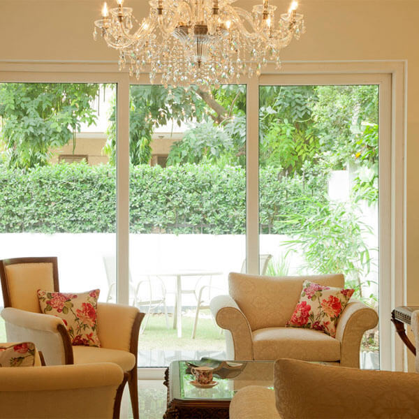 One of the most preferred styles that people opt for today are sliding doors. The design of a sliding door is crafted in such a way that it offers unhindered access and doesn’t take up too much space. As the functioning of sliding doors is effortless and noiseless, the mechanism of sliding doors is also often referred to as the Silent System.Enhance the aesthetic appeal of your home with a wide range of elegant sliding doors by Fenesta. We are a leading manufacturer and supplier of high-quality uPVC sliding doors in India. All our doors are engineered with extreme precision and care. The use of top-notch materials and new-age techniques for the crafting and designing of our doors have helped us become the preferred choice for fenestration in India.FEATURES & BENEFITSSliding doors by Fenesta offer numerous aesthetically appealing fixturesuPVC sliding doors keep the internal temperature of the home regulatedThe doors are highly energy efficientuPVC sliding doors by Fenesta are designed with sound insulation propertiesDoors are fusion welded and designed with silicone sealant and laminated glassAt Fenesta, only high-quality materials are used for the manufacturing of the doorsuPVC sliding doors require minimal maintenanceThe doors are robust and sturdy, suitable for all regions in the countryThe installation of sliding doors by Fenesta also ensures an improved security aspect.WHY CHOOSE UPVC SLIDING DOORS?Sliding doors are equipped with two or more sashes that are placed on tracks that allow the doors to slide horizontally. The sliding mechanism can either go from left to right or vice-versa, depending upon the installation; and when the doors are placed upon their tracks, the sliders can either be placed at the top of the door or at the bottom. Sliding doors are installed parallel to the walls and generally have two panel sections, where one of the panel sections is fixed and the other is moveable.Fenesta’s range of uPVC sliding doors is robust and requires very less maintenance thanks to the sturdiness and durability. You can also choose to install Fenesta’s sliding doors at offices, for they promise to impart a great first impression to anyone who visits, and they do not require a lot of efforts when it comes to maintaining their new-like appearance. The construction of these doors ensures that they can stand strong against radiation and climate changes year after year. This again helps in reducing the maintenance costs of the sliding doors as well.Some notable features of the sliding door range by Fenesta is that these doors also come with a multi-chamber system that helps in enhancing the heat and sound insulation properties. Fenesta’s uPVC sliding doors also come with rain tracks and sill insulation to protect the doors from the effects of rain. Then, when it comes to security for your home, the uPVC sliding doors come with multi-point locking systems, a double toughened glass, as well as uPVC frame grills, which work to make sure that no burglar can break into your home.Fenesta’s uPVC sliding doors have a number of features that offer cutting-edge advantages. With Fenesta, you also have the option of choosing uPVC sliding door designs that are wider and taller, which may involve the addition of more uPVC sliding sashes, if required. At Fenesta, we believe in prioritising the requirements of our clients and make sure that all their needs and requirements are met.TYPES OF UPVC SLIDING DOORS1. BYPASS DOORS:One of the most common variants of sliding doors is the Bypass Door. These doors are designed with two or more sections. Bypass doors can slide from one direction to the other along the axis on parallel tracks, which are placed overhead. Bypass doors can be installed at various places, but the most common installation is done for closets, or what is also known as sliding door wardrobes.2. POCKET DOORS:Touted as one of the most convenient styles, this variant of the uPVC sliding door is designed to disappear into the wall. The doors, when fully opened, disappear inside a wall-cavity which is why they are known as pocket doors. These sliding doors are best suited for kitchens that have less space. However, these doors can prove to be highly efficient in bedrooms and other places as well where you have less room. For pocket doors, the rollers or sliders are suspended either from an overhead track or are fixed at the feature tracks along the floor. A single track or a 2-track sliding door can be installed depending on the width of the entrance.3. ARCADIA DOORS:These are sliding glass doors that are generally used as the entrance door to a backyard. These doors are large glass windows that provide access to the outdoors. Arcadia doors are also referred to as balcony sliding doors because of where they are mostly installed. Since these doors are quite large, they also allow ample natural light and fresh air into your home when opened. The Arcadia sliding glass doors for the balcony are designed as a single unit, which generally has two panel sections. The moveable panel is called the active leaf and the fixed side is called the inactive leaf. With the unique features and benefits offered, the prices of these sliding glass doors are quite reasonable.4. SLIDING FRENCH DOORS:Yet another type of sliding door is the French Doors. Though people don’t generally imagine French doors to be sliding doors, with the many advancements in door manufacturing, at Fenesta, you can easily find the perfect design for stylish sliding French doors that certainly add grace to space.Some other variants of sliding doors include the folding sliding glass doors, patio sliding doors, barn sliding doors, and more. Apart from the double-track uPVC sliding doors, Fenesta also has a range of 3-track uPVC sliding doors and 4-track sliding doors. You can also browse through our collection of uPVC sliding doors for the bathroom or kitchen, based on your needs. At Fenesta, you can peruse our range uPVC sliding doors, at the best prices in India. Being the leading manufacturer of sliding doors, we ensure that you get nothing but the best in products and services.