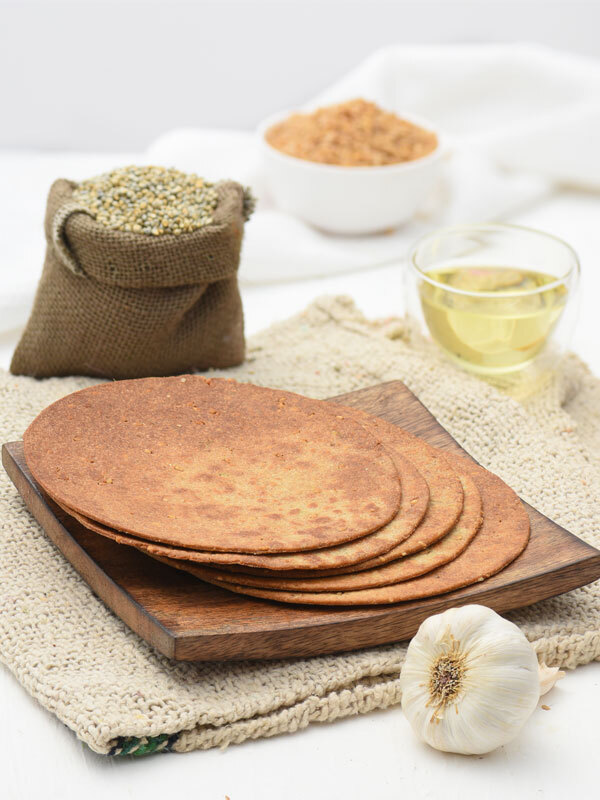 Bajra Lasun Rotla is traditional indian flatbread consumed in western parts of India. It can be served with dal, lahsun ki chutney, white butter or onions. It is extremely delicious and is liked by everybody.Benefits –1. Helps in weight loss2. Reduces cholesterol level in the body3. Digestion of food in the body4. Highly nutritious
