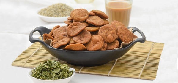 Bajari Vada is a vegan snack of gujrati cuisine. It is made from pearl millet flour, spices and few herbs. The main ingredient used in this snack is Bajra which is a good warming food grain. These bajari vadas can be served with curd or can be taken along with tea or coffee as an evening snack. They can also be taken for picnics and travels. But they must be stored in an airtight container.