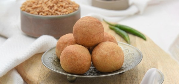 Baked Kachori are a delight and tasty snack. This snack is usually a round flattened ball made of fine flour filled with a stuffing of urad dal. It is a healthy snack and the best way to satisfy your munchies without the worry of to many added calories. The kachoris are usually deep fried but baked kachoris is a healthier version as they are baked instead. The taste however is not at all compromised and neither is the texture or appearance.