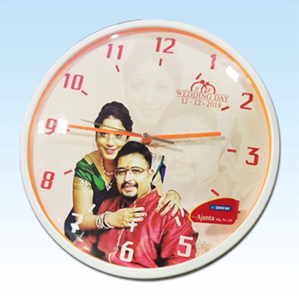 Create your Own Customized Photo Printed Wall Clock Add your favorite Images, Text, Designs easily. The print on this wall clock is permanent, it will never fade off in general use. It can be gifted on various occasions like Birthday, Wedding, Anniversary, Valentine’s Day and more. One Personalised Wall ClockMaterial- Frame: Wood & Cover- AcrylicDimensions- 12 x 12 inches; Thickness: 8 mmWall Mount- Yes