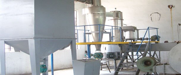 Spin Flash Dryers if the wet cake is a paste or sludge, swirl flash dryer is the most suited for drying application. The dryer is fitted with a mechanical agitator which helps to disperse the wet cake without any need for back mixing of the dry powder. the feeding system includes a feed tank with agitator and a screw feeder for feeding into the drying unit. The heart of drying process is cylindrical drying chamber, where the drying air enters the air distributor. The tangential air distributor of special design introduces the air as an intense swirl flow. the simple spin flash dryer is designed to handle materials that can be suspended directly in air. The drying process usually is completed in 0. 5 - 2 sees, and the final moisture is generally in the constant rate drying zone. Various types of spin flash dryers designs are available based on uniform / non uniform particle size of the feed / product. the feeding of cake is through specially designed paddle mixer / screw conveyor with / without rotary injector depending on rheology of feed material. For difficult to handle feed materials part of dried powder can be re-cycled. Spin flash dryers are suited for filter cakes, semi dried powders.