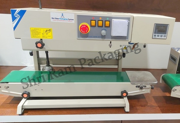 Vertical Band Sealing machine with nitrogen flushing As the name suggests: This seals the packaging material by filling Nitrogen gas into the product to maintain durability. This Nitrogen filling machine is widely used for packaging food equipment Like nankeen; cashew; chips etc. medicinal products, chemical items, products of daily use and vegetable seed, etc. This is also known as Gas flushing Machine with Sealing. You should have ever wondered how the packets of chips do not get perished even after a long time? It is because Nitrogen gas is filled to preserve the items and prevent them from being perished. Thus filling nitrogen makes the packet look bigger. Also One needs to set the pressure of nitrogen and can adjust the time required for sealing of one pouch. Set the temperature high if the pouch is thick and as 'low' if the pouch is thin in nature. Hence, the setting of the temperature depends upon the thickness and thinness of the pouch. After then place the packaging material on the band sealer conveyor, it will automatically move forward and thus seal the pouch. Band sealer seals the pouch covering the width of 6-12 mm.