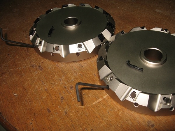 This cutter is developed for gang milling operation. The diameter of the cutter is 200 mm. The cutter inserts are clamped using special lever arrangement.
