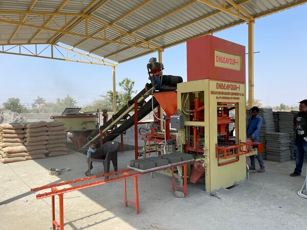 Automatic Fly Ash Bricks PlantModel: ENDEAVOUR-iF1500Production Capacity: 6 Bricks per Stroke / 1600 to 1800 Bricks per HourStandard Bricks Size:230 mm X 110 mm X 75 mm (Size Option Available)Pressing Capacity: 60 MT Max.Pan Mixer:650 Kgs X 01 NoHydraulic Oil Qty: 250 LtrsControl Panel: PLC Based user Friendly Control PanelLabor Requirement: Operator – 1 + Skilled Labor – 1 + Unskilled Labor – 10Total = 12 (Depends on Labors Efficiency & Management)Pallet Size: 570 mm X 430 mm X 19 mmTotal Connected Power: 23 HP / 17.25 KW – 3 Phase / A. C. / 440 Volts / 50 Htz