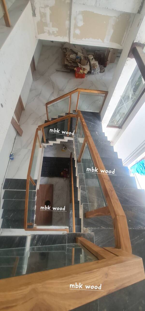 Wood and glass staircase railing best material wood indian teak size 48mm by 48mm pillar size. Same size hand rail .12mm tuffend glass sentgobin complete with polish finishes colors as per your choice brand mbk wood carving works in hyderabad telangana yousuf guda rahmath